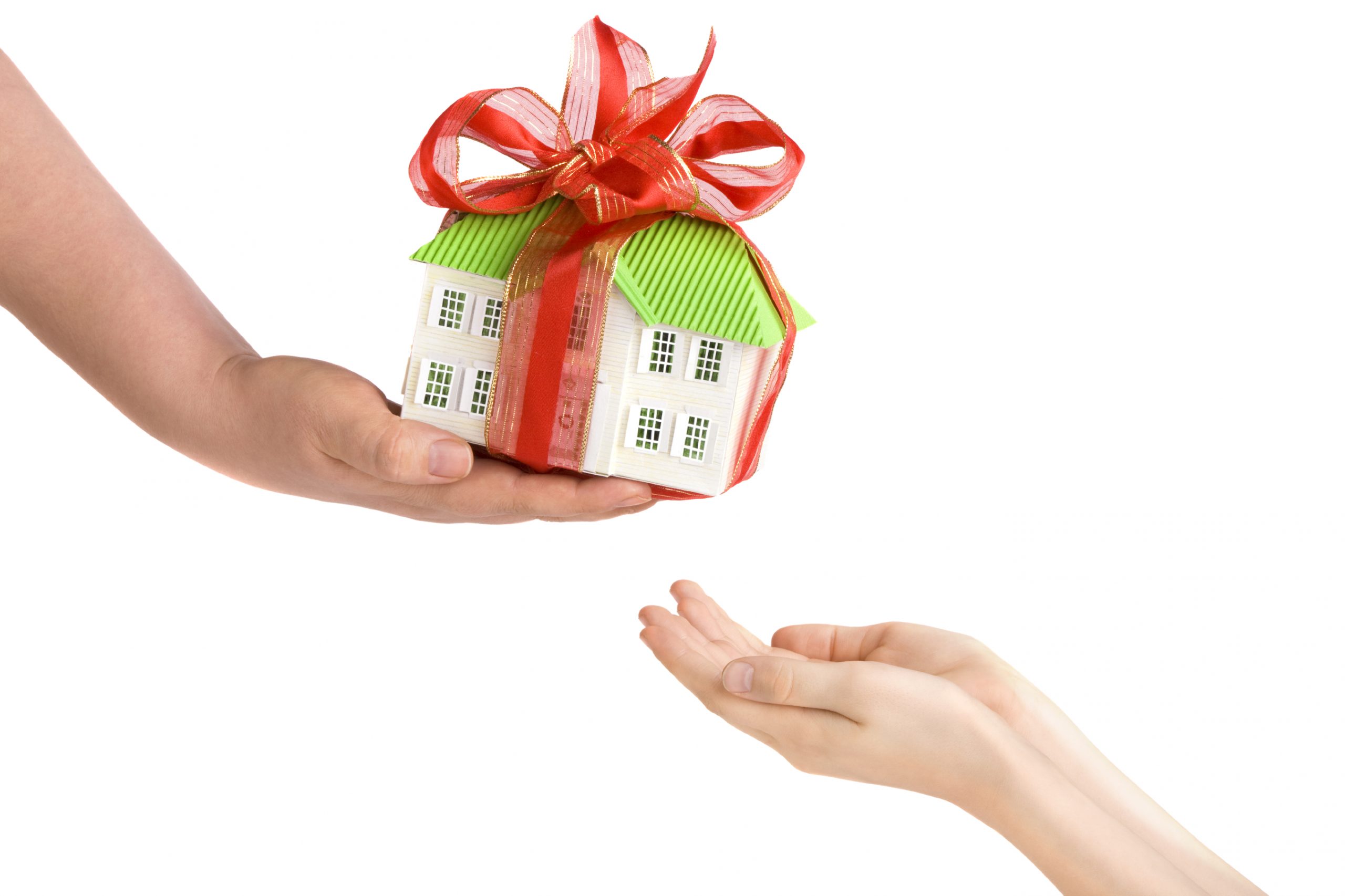 Adults Hand Giving Childs Hands a Model of the House scaled