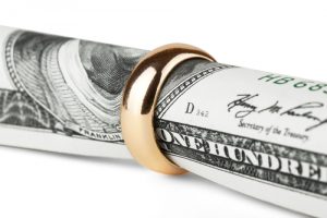 Banknote and ring symbolizing financial solutions and legal support.