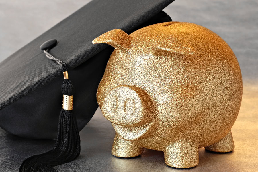 Gold piggy bank with graduation cap, symbolizing financial education and planning for students.