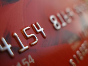 4543 credit card close-up highlighting embossed numbers and sleek metallic details for financial relief.
