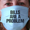 Bills are a problem sign on a face mask, representing financial stress and debt issues.