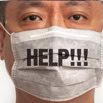 Worried man wearing a face mask with "I am worried" message for bankruptcy stress.
