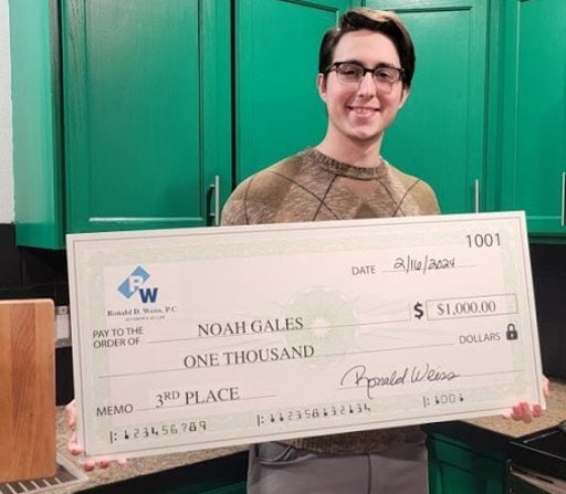 Large check for $1,000 made out to Noah Gales presented by lawyer, symbolizing legal assistance.